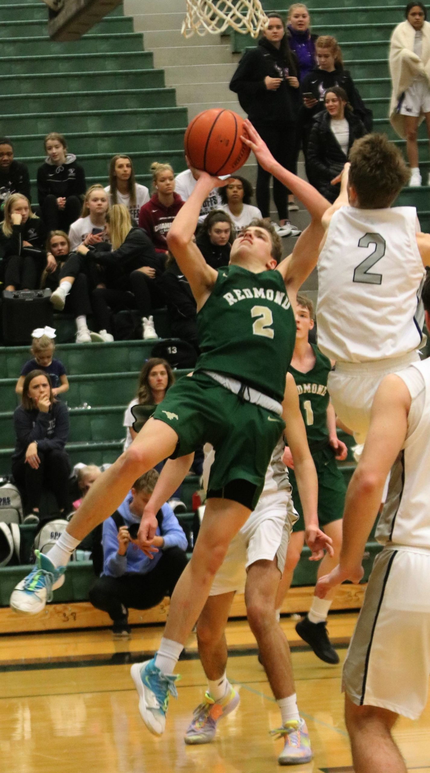 Redmond’s Nathan Miller drives to the hoop. Andy Nystrom/ staff photo