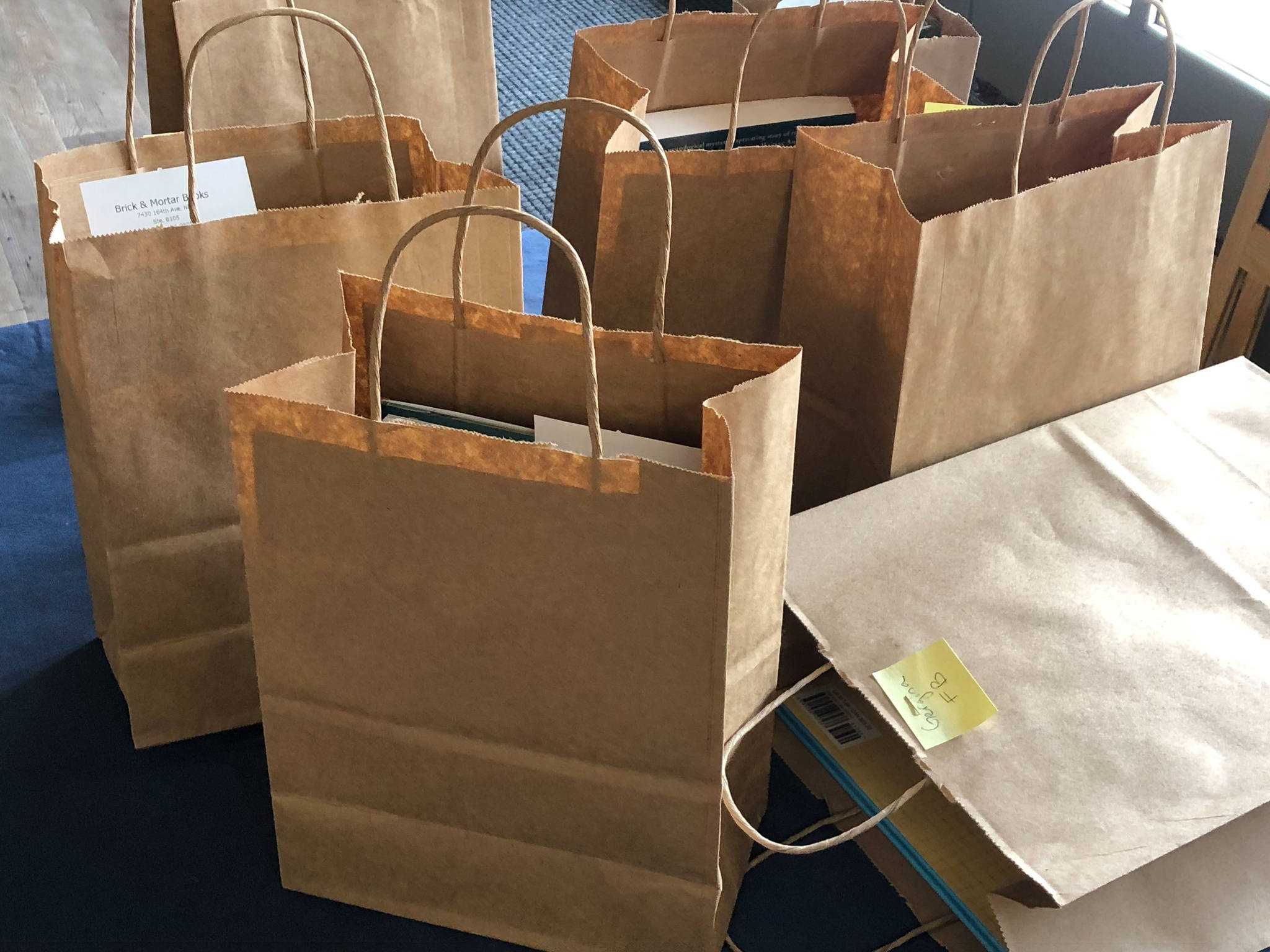 Bags await curbside delivery at Brick & Mortar Books in Redmond Town Center. Photo courtesy of Brick & Mortar Books