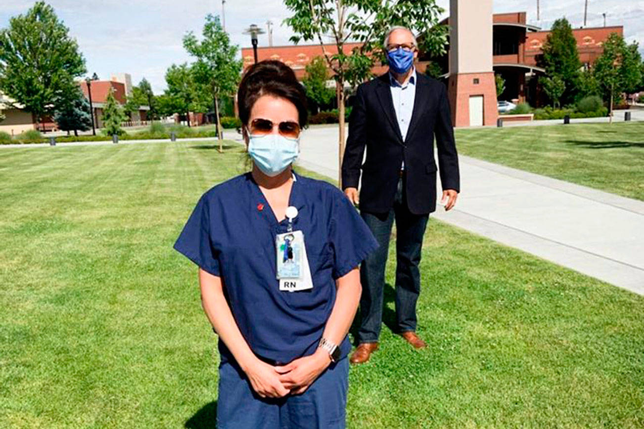Nurse Sylvia Keller, pictured with Gov. Jay Inslee, is on the front lines of the COVID-19 battle in Yakima County. Courtesy photo