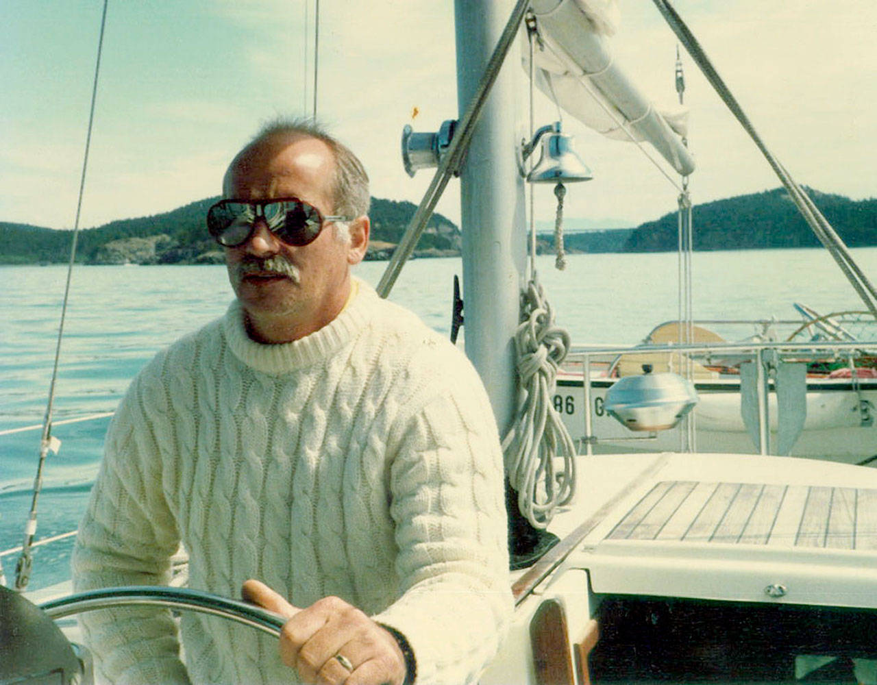 Gary Parks sits at the helm of his 41-foot sailboat not long before his death in 1987. (Family photo)