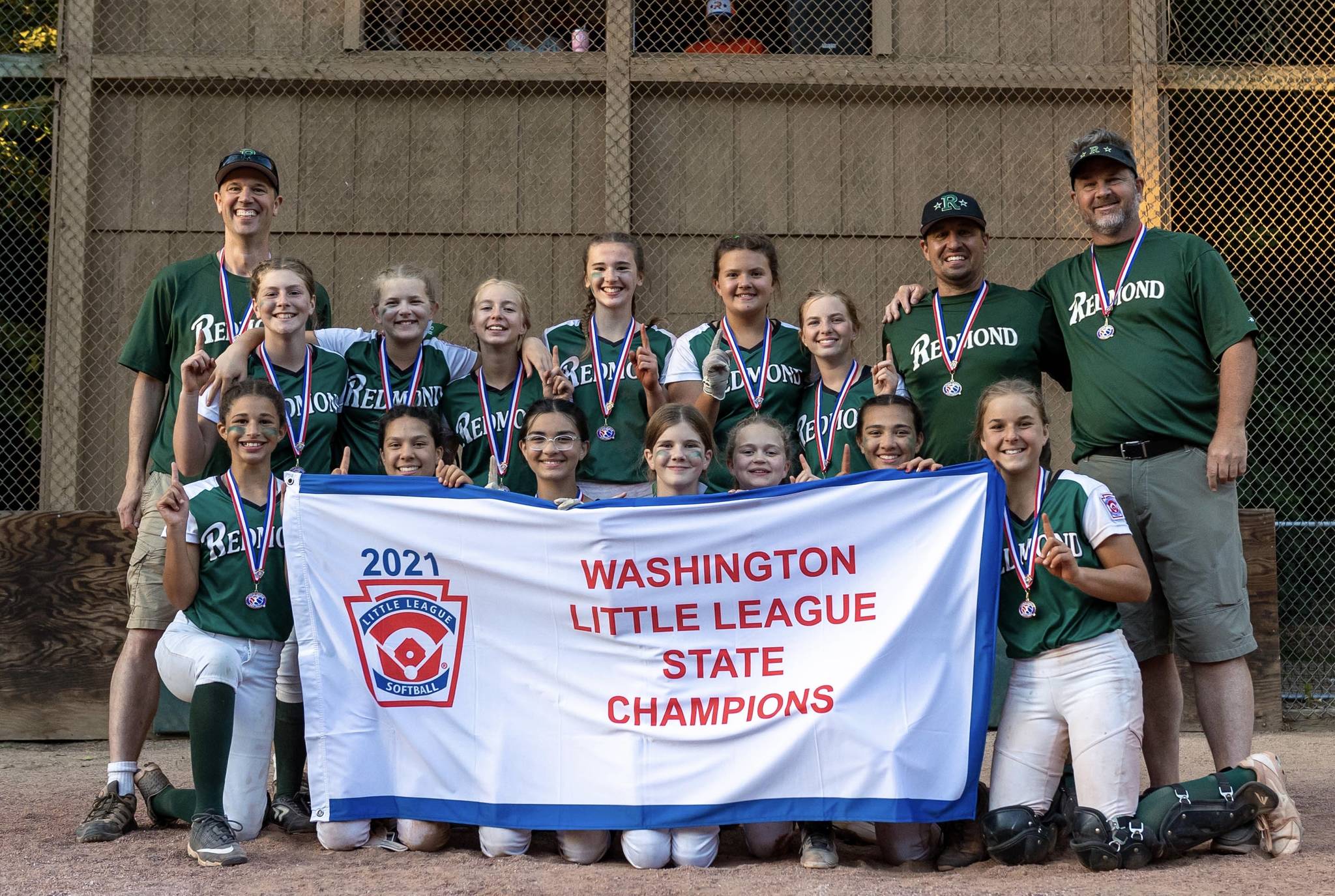Redmond Little League’s state-championship softball majors squad. Top row (left to right): Coach Wes Barcalow, Julia Cady, Ella Carter, Livy Ruess, Ainsley Barcalow, Mia Perez, Addy Ruess, manager Casey Ruess and coach Robert Hartman. Bottom row (left to right): Daisy Walker, Simone Loving-Williams, Ella Enich, Abby Hartman, Zoey Cooper, Maggie Enich and Kati Cygan. Photo courtesy of Swen Richter