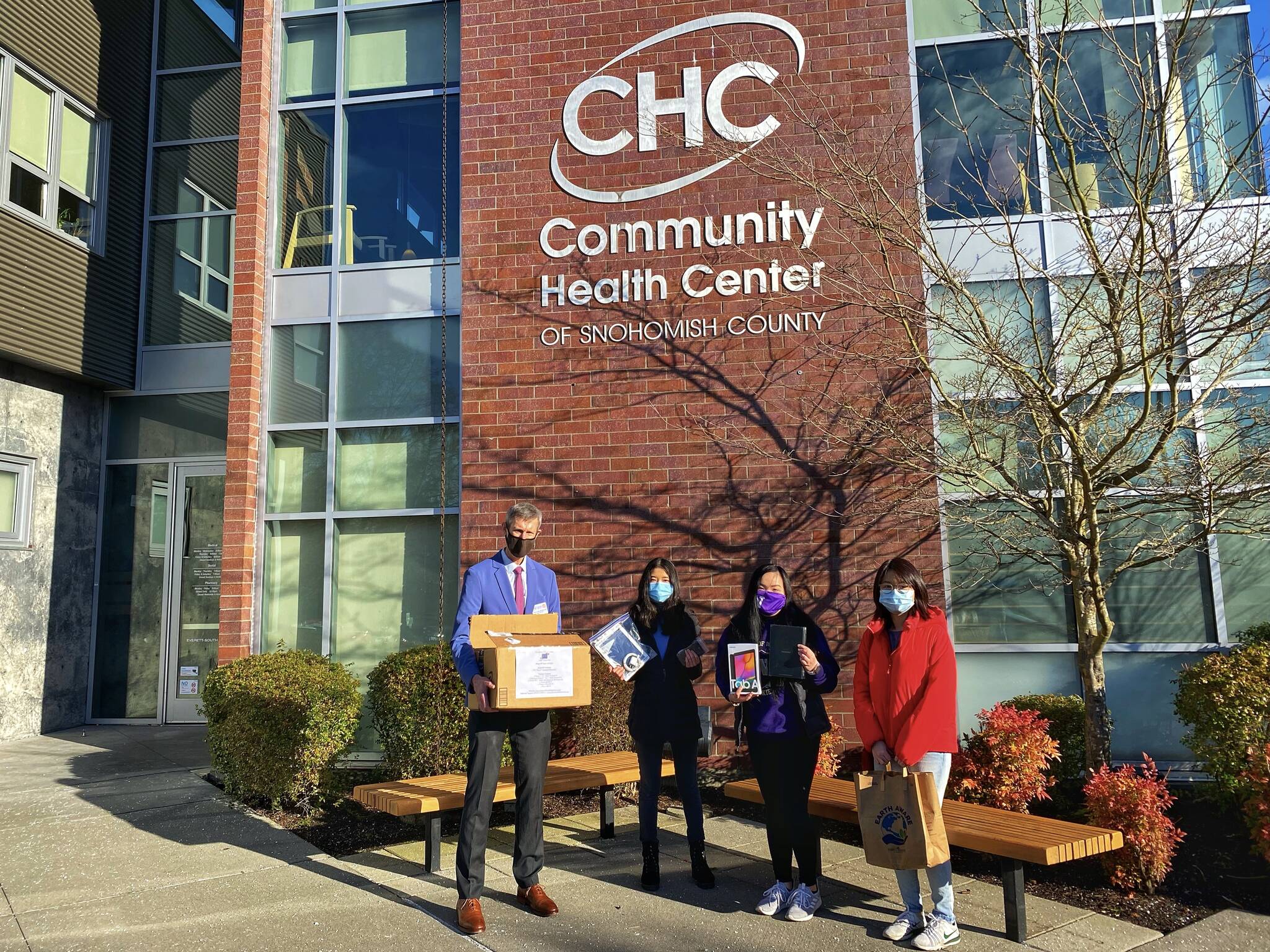Cui, second from left, is part of the device drop-off team at the Community Health Center of Snohomish County in Everett. Courtesy photo