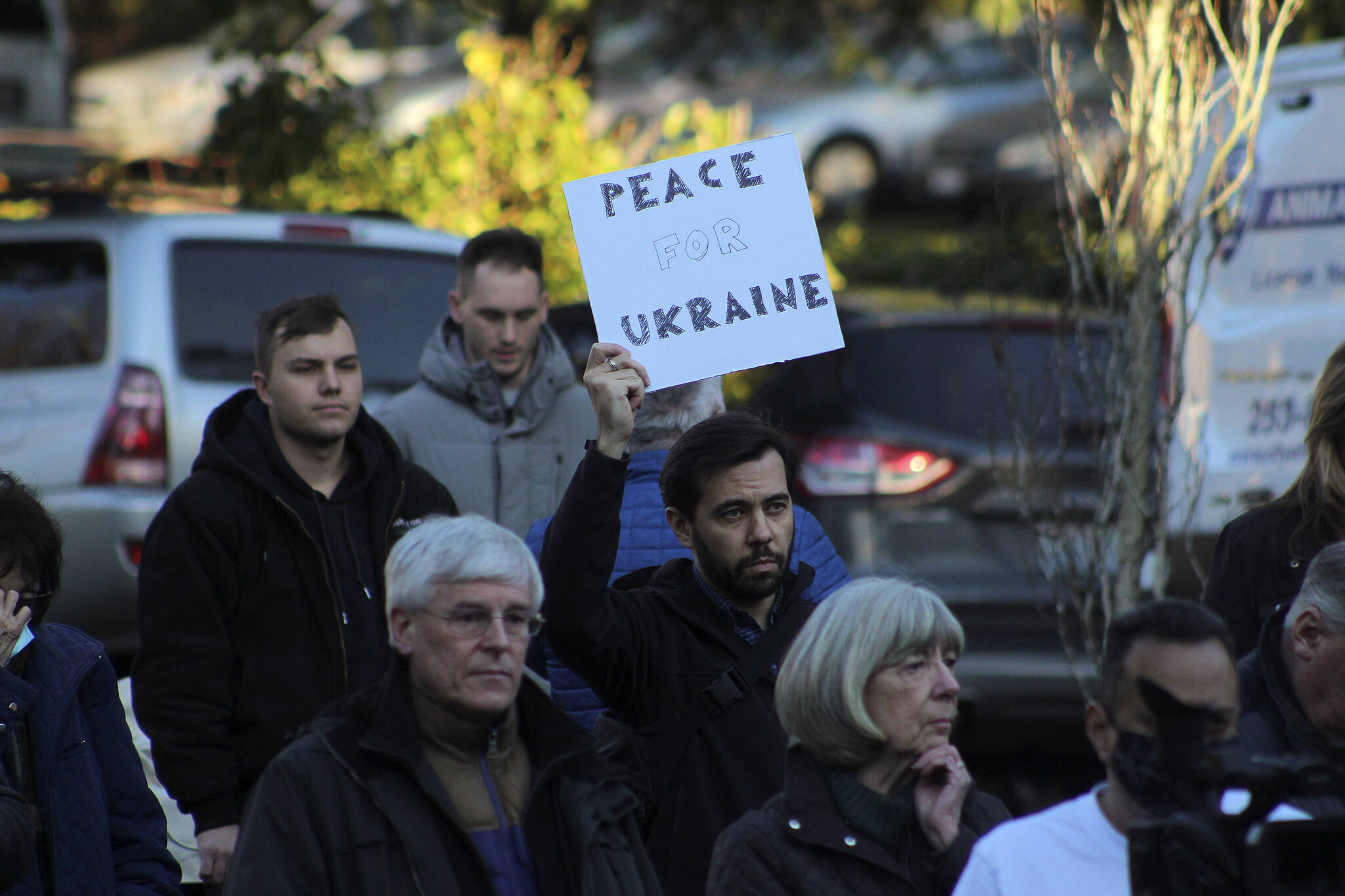 Igor Soloydenko, who said he identifies as Russian, holds a sign urging “Peace for Ukraine” at a ceremony Feb. 25 in Federal Way. Soloydenko said: “There’s just so much shame. I feel helpless in the way I cannot change anything in my home country. It was unimaginable that Russia would do such a thing.” Olivia Sullivan/Sound Publishing