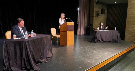 King County prosecutor candidates Jim Ferrell (left) and Leesa Manion debate Sept. 28 at Carco Theatre in Renton. The forum was moderated by Renton Chamber of Commerce CEO Diane Dobson (center). Photo by Cameron Sheppard/Sound Publishing