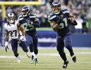 Bruce Irvin returns an interception for a touchdown against St. Louis in Week 17.