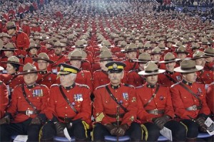 Mounties and police officers fill the Tacoma Dome seats during yesterday's memorial service for four Lakewood Police officers. Laura Pierce