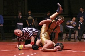 Inglemoor High senior standout Anthony Bratcher (26-1 on the season) puts a hold on Redmond's Brandon Long during the 135-pound finals at the 4A Kingco Wrestling Tournament. Bratcher won by decision