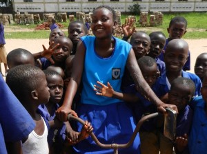A student is all smiles on her new bike through the Village Bicycle Project
