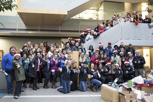 Microsoft employees are all smiles after collecting thousands of gifts to donate to six local non-profits as part of its Giving Tree program.