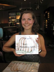 Berkleigh Rathbone displays her “Miss Karlein’s Pumpkin Patch” book.