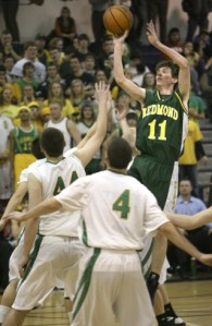 Redmond's Chris Harrington shoots the ball over the Roosevelt defense during fourth-quarter action of the Mustangs' 50-44 win. Harrington scored 22 points in the victory.