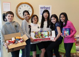 Willows Preparatory students with food donations to Northwest Harvest. The total collected exceeded 300 pounds