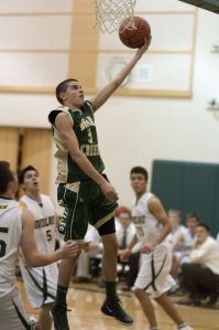 Bear Creek sophomore Jesse Leuenberger finishes off a coast-to-coast drive for two of his game-high 15 points in a 63-39 win over Overlake last night.
