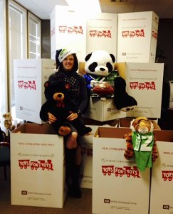 Tracy Crowley of Edward Jones investments in Redmond is surrounded by Toys for Tots donations.