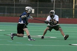 Senior captain Sean 'Chewy' Shewey defends against a Northshore attacker during a league match last season.