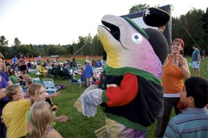 Kids crowd around as Bert the Salmon