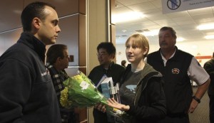 Kayla Oswald (center) speaks with Matt Balser