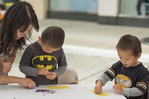 Youngsters work on an art project during last Saturday's Superhero Block Party at Redmond Town Center.