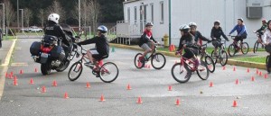 Redmond Middle School sixth-graders ride with a Redmond Police Department motorcycle officer.