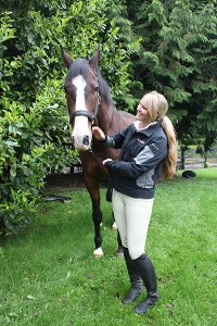 Jordán Linstedt plays with her horse Jack at Saddle Rock Stables on Redmond Ridge.