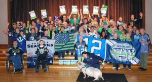 Bitsy the pig from Farrel-McWhirter Farm Park joined the Redmond Senior Center and Redmond Recreation staffs to show their Seahawks spirit on Friday.