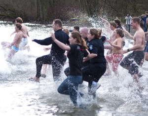 Dozens of Redmond Police officers and residents ran into the frigid waters of Lake Sammamish last New Year's Day morning to help raise money for a Special Olympics. The Redmond Police Department will be hosting its fifth annual Polar Plunge Jan. 1 2011 at Idylwood Beach Park. The last Redmond Polar Plunge raised more than $10