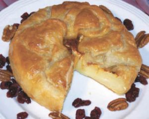 Carmel and pecan dessert brie is sure to impress your holiday guests.