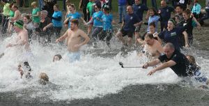 People brave the approximate 46-degree Lake Sammamish waters at Idylwood Park this morning for the Redmond Police Department Polar Plunge to benefit Special Olympics. An officer even risks getting his selfie stick wet during the plunge.  Story to come.