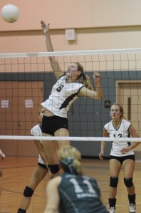 Sophomore Makena Schoene goes up for a spike against Evergreen Lutheran on Tuesday night at The Bear Creek School. Schoene