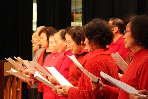 A Chinese chorus featuring singers from the greater Eastside perform at the Redmond Senior Center's Lunar New Year celebration.
