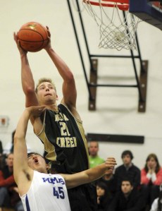 Bear Creek forward Ryan Strandin stretches out for two during the Grizzlies' 45-31 win over the Pumas last Saturday. Strandin scored 11 in the win