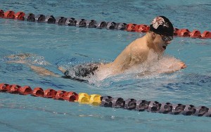 Caleb Alleva swims the breaststroke during Friday's prelims at the 4A state swim meet at the King County Aquatic Center in Federal Way.