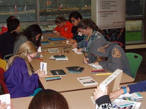 Attendees at this year's Girls Unlimited event at the DigiPen table.