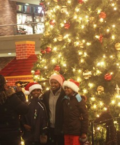 People gather in front of the Redmond Town Center tree last December.