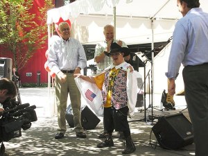 Herb Bartlett draws a crowd while performing his Elvis Presley impersonation on Tuesday during a barbecue at Physio-Control