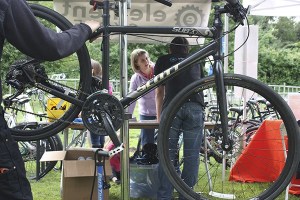 A 2013 Bike Bash attendee has her bike checked out.