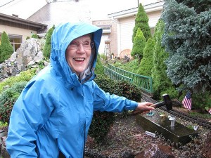 Emerald Heights resident Rainy Husband drives the Silver Spike on the community's garden railway.