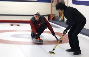 Redmond resident Bob Knievel tosses a stone while his wife