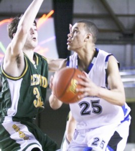 Redmond’s Jared Alexander applies some defensive pressure to Federal Way’s Cole Dickerson during the Mustangs’   66-36 loss to the top-ranked Eagles in the first round of the Class 4A state tournament Wednesday morning. Redmond came back and beat Todd Beamer