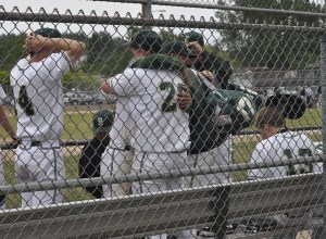 Redmond players embrace after falling to Kentwood