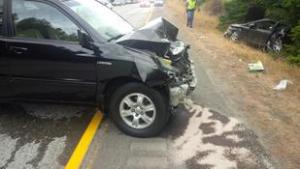 One of the cars in Saturday's fatal accident on Interstate 90 sits near the side of the road.