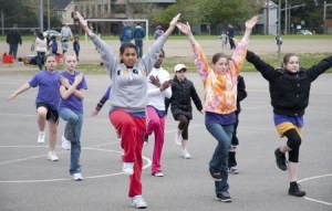 Members of the Eastside Precision Drill Team practice on the playground at Redmond Elementary School for this weekend's Seattle All City Drill Team competition in Edmonds. The team is recruiting more girls from grades K-12. For information