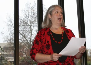 City of Redmond poet laureate Rebecca Meredith recites her poem 'Sweat' at a First Friday Coffee Chat at the Redmond Senior Center. Meredith is the city's first poet laureate and began her two-year term in January. Although she is now a Seattle resident