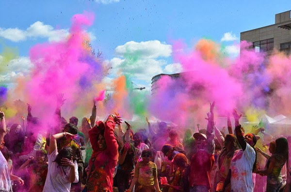 People celebrate spring at Redmond City Hall with the Festival of Color.