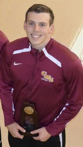 Zach Alleva holds his fifth-place trophy after swimming on Claremont-Mudd-Scripps' 200-yard medley relay .