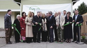 Elected officials join Friends of Youth officials to cut the ribbon for Friends of Youth’s new transitional living homes for homeless youth. From left: State Sen. Andy Hill