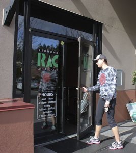 Joy Hutton enters the Redmond Athletic Club in downtown to say goodbye to the friends she has made over the years as a member of the gym.