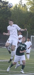 Redmond High's Stephen Jinneman goes up for a head shot against Skyline High on Tuesday.