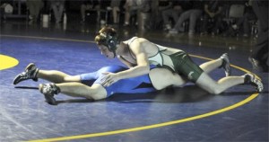 Redmond High captain Tyler Black (top) pins Hazen’s Kyle Ely during a preseason meet at Hazen High School on Dec. 4. The senior