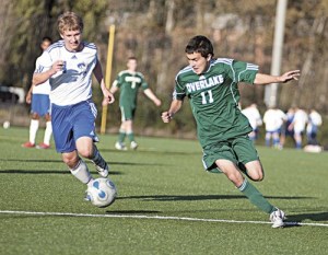 Overlake School junior midfielder Rohan Kumar takes the ball upfield during the Owls' 4-0 win over Bellevue Christian at Marymoor Park on Tuesday afternoon. Kumar scored on a penalty kick and also notched an assist in the win.